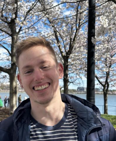 close up man in front of trees
